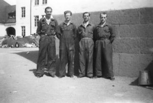 Workers at the reception center in Sweden (former prisoners in background)