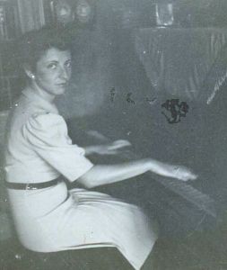 Rosie playing piano at Ernst's place, 1941