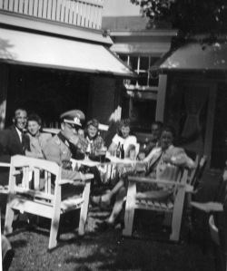 Rosie on a café terrace with a German officer